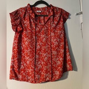 Orange blouse with white detailing